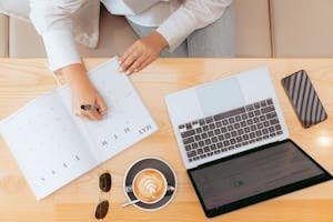 Top View of Workspace with Planner and Coffee